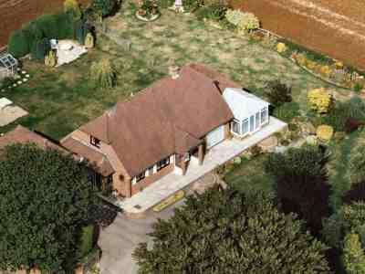 An aerial view of the brick-built Timber Cottage, which replaced the original ramshackle building in 1986. The photograph was taken in 1996.