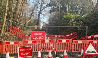 A major national road, the A29 at Pulborough, brought to a complete halt by a landslip in December 2022. For reasons disputed between local landowners and the Local Authority, the road remained fully closed for well over a year, and only finally introduced a limited alternate one way route controlled by traffic lights to take the pressure off the long diversion route recommended by West Sussex County Council